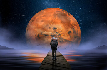 Wall Mural - backpacker walking on wooden footbridge with planet mars in the background