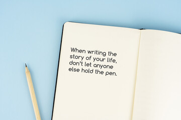 Wall Mural - Notepad with inspirational quotes text - When writing the story of your life, don't let anyone else hold the pen