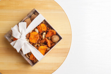 Wall Mural - Dried fruits and nuts, branch on white background . Concept of the Jewish holiday Tu Bishvat. Copy space