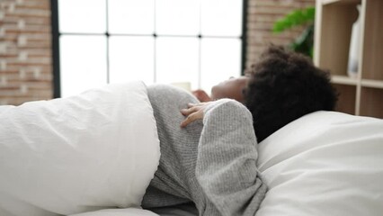 Sticker - African american woman lying on bed sleeping at bedroom