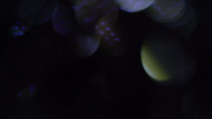 Wall Mural - Silver Blue Light Leaks Footage on black background. Lens flare leak burst overlays. Lighting lamp rays bokeh effect. For compositing over your footage, overlays or transitions.