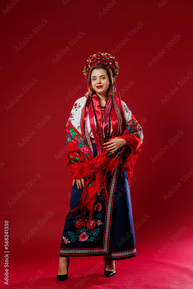 Photo Stock Portrait of ukrainian woman in traditional ethnic clothing and  floral red wreath on viva magenta studio background. Ukrainian national embroidered  dress call vyshyvanka. Pray for Ukraine | Adobe Stock