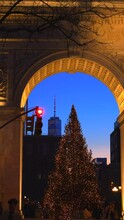 NEW YORK, NEW YORK – DECEMBER 30: The Christmas Tree Stands In Front Of The Washington Square Arch In The Dusk At Washington Square Park In Greenwich Village On December 30. 2022 In New York City.