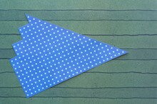 Blue Scrapbook Paper Triangle With Spots On Green Scrapbook Paper With Lines