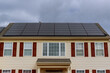 modern houses with solar panels on the roof for alternative energy