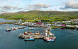Portmagee fishing village on the Ring of Kerry Iveragh Peninsula. County Kerry, Ireland. Aerial drone view looking south