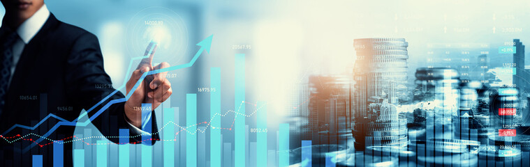 Businessman analyst working with digital finance business data graph showing technology of investment strategy for perceptive financial business decision. Digital economic analysis technology concept.