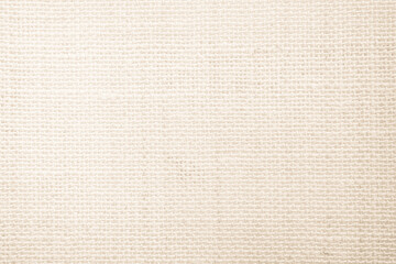 Jute hessian sackcloth burlap canvas woven texture background pattern in light beige cream brown color blank. Natural weaving fiber linen and cotton cloth texture as clean empty for decoration.