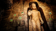 Buddha Statue In Bamiyan Cave On The Grounds Of Golden Mount Temple (Wat Saket). Landmark In Bangkok, Thailand.