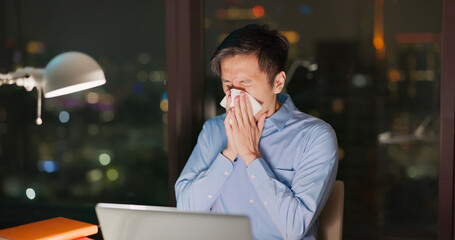 Wall Mural - Business man sneezes at work