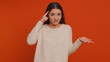 You are crazy, out of mind. Pretty young woman pointing at camera and showing stupid gesture blaming some idiot for insane plan, bullying. Millennial confused girl isolated on red studio background