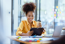 Young African American Businesswoman Working With Pile Of Documents At Office Workplace, Business Finance And Accounting Concepts.