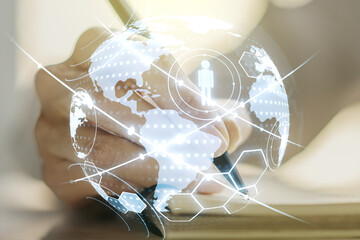 Poster - Social network media concept with world map and woman hand writing in diary on background. Double exposure