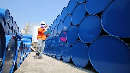 Poster - Male worker inspection record drum oil stock barrels blue horizontal or chemical for in industry