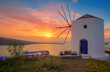 windmill at beautiful sunset on oia Santorin