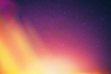 Wall Mural - Night Dark Blue Sky Glowing Stars Background Backdrop With Sky Gradient. Colourful Night Starry Sky Gradient. Amazing Night View Sky. Bright Purple, Yellow And Orange Colors.