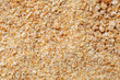 Breadcrumbs, crushed dried bread, small grains, background uniform texture, in bulk, close-up
