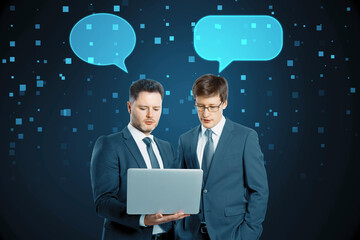 Poster - Businessmen with speech bubbles using laptop together on blurry squares blue background. Technology, metaverse, teamwork and success concept.