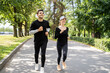 © muse studio - Full-height people couple friends training running together in sportswear. Healthy lifestyle hobby for every day.