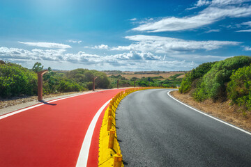 Sticker - Beautiful landscape with roadway and bike path. Empty asphalt road travel background