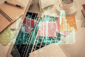 Poster - City drawing over computer on the desktop background. Top view. Double exposure. Smart home concept.