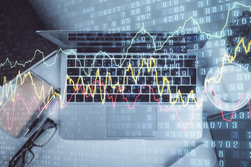 Poster - Multi exposure of financial chart drawing over table background with computer. Concept of research. Top view.