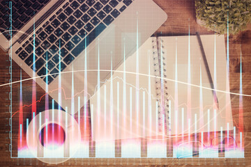 Poster - Financial market graph and top view computer on the desktop background. Double exposure. Investment concept.
