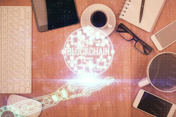 Poster - Double exposure of blockchain theme hologram over table with phone. Top view. Crypto technology concept.
