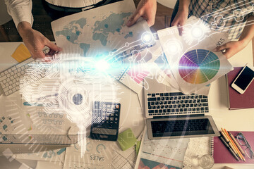 Fototapete - Double exposure of man and woman working together and human brain hologram drawing. Brainstorm concept. Computer background. Top View.