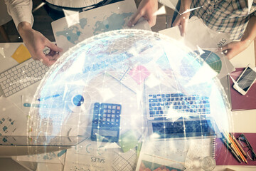 Fototapete - Double exposure of man and woman working together and business theme hologram drawing. Computer background. Top View.