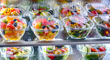 Boxes With Fruit And Vegetable Salads In A Commercial Fridge
