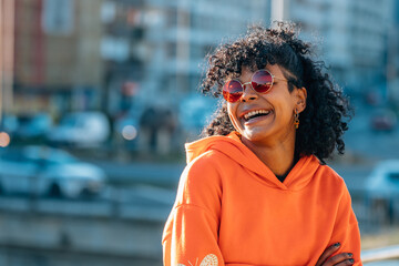 Wall Mural - afro american girl in street smiling happy