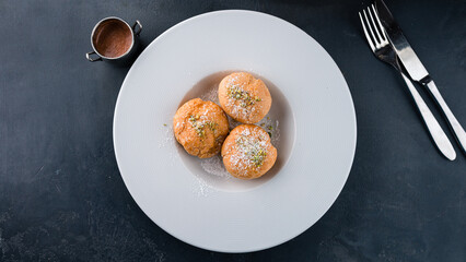 Wall Mural - Profiteroles stuffed with whipping cream in plate.