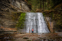 Boys Gazing At A Waterfall