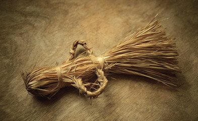 Vintage straw doll.The old way of weaving toys from reeds. An ancient children's toy.