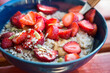 Oatmeal porridge with nuts and strawberries