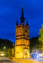 Wall Mural - Antique belfry tower in courtrai illuminated by yellow light, Flanders, Belgium