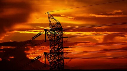 Wall Mural - Electricity power lines over dramatic orange color sunset sky