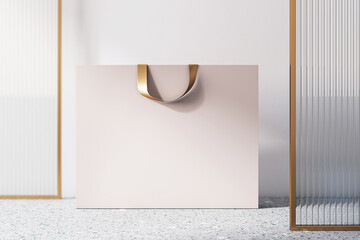 Poster - Front view on blank beige paper shopping bag with golden braid and space for your brand name or text on concrete floor and light wall background, closeup. 3D rendering, mock up