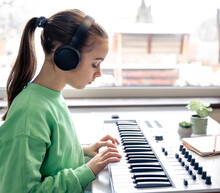 Little Girl Learning To Play The Piano At Home, Music Lesson, Learning.