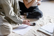 © Westend61 - Mature couple calculating with calculator and discussing over documents