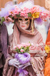 People wearing colorful masks and costumes during the Venice Carnival