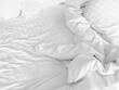 Black and white tone of crumpled blanket, wrinkled bed sheet on bed in the home or hotel bedroom