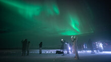 People Staring To Their Cell Phones While Taking Photos Of The Northern Lights. Looks A Bit Futuristic, Not? This Pic Somehow Reminds Me Black Mirror And How We Are Addicted To Capture Everything.