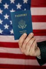 business man wear suit holding U.S. passport