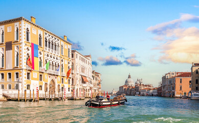 Wall Mural - Traffic on the Grand Canal and Santa Maria della Salute in the background, in Venice, Veneto, Italy