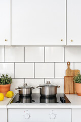 Wall Mural - glass ceramic induction stove at cozy kitchen, cooking concept