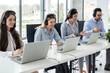 © Bojan - Group of friendly customer care support operators working in call center.