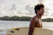 Indonesia, Lombok, Side View Of Male Surfer Looking At View