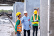 © Tongpool - At building construction site supervisor check quality precast concrete panel before installation